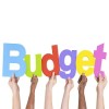 Multiethnic Group of Hands Holding Budget